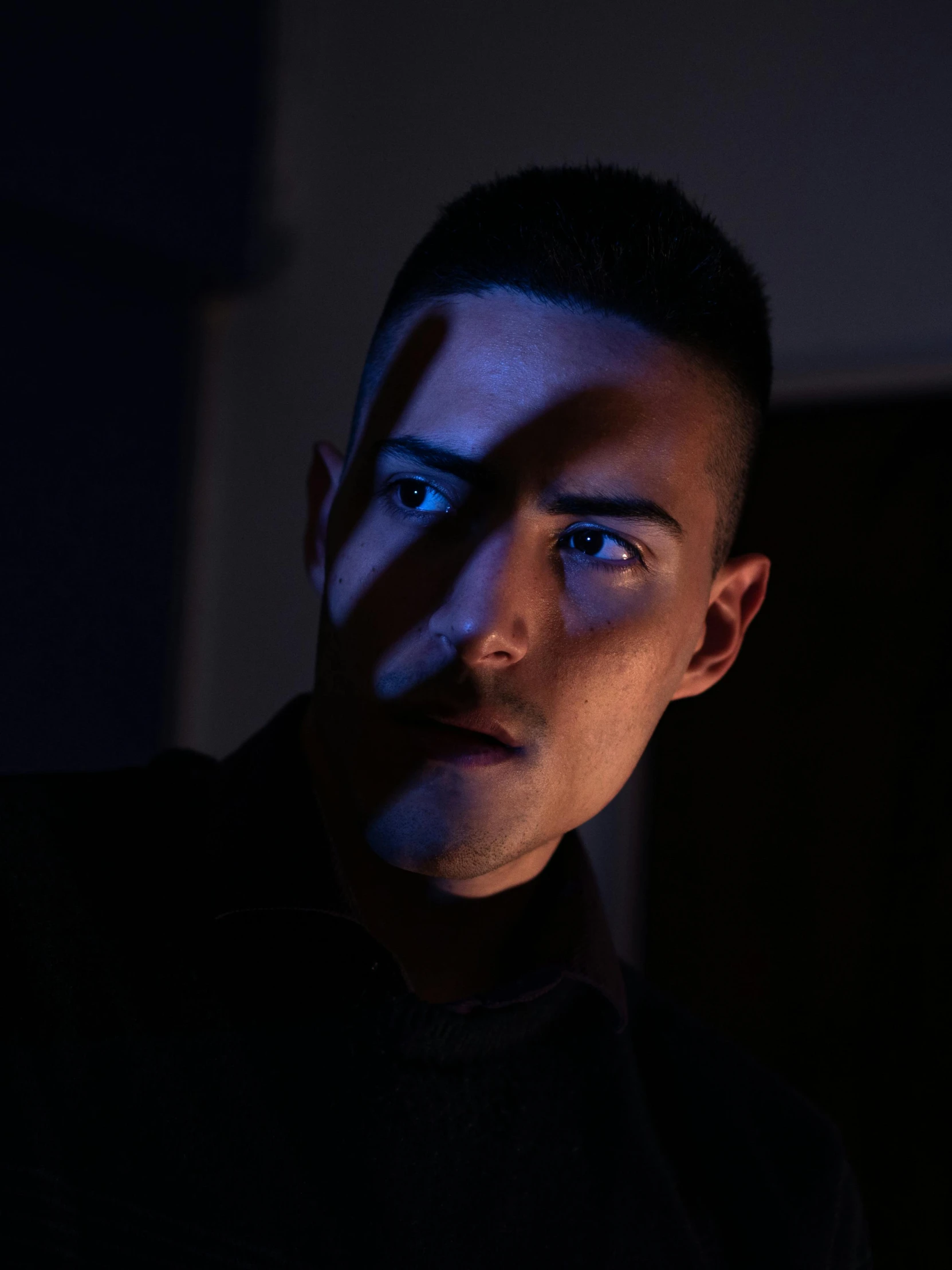 a close up of a person in a dark room, a character portrait, by Alejandro Obregón, bisexual lighting, portrait. 8 k high definition, instagram picture, shadowy informant
