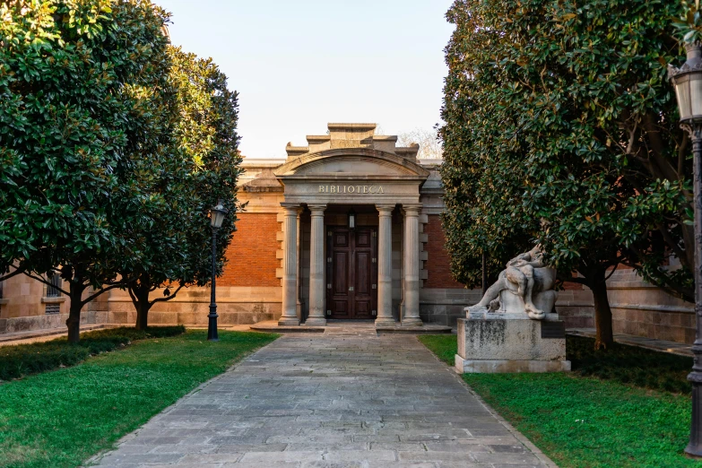 a walkway in front of a building surrounded by trees, a marble sculpture, by Pedro Álvarez Castelló, pexels contest winner, neoclassicism, venice biennale, private academy entrance, profile image, exterior photo