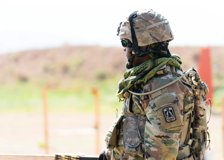 a close up of a person in a military uniform, desert breathing armor, military buildings, edd, australian