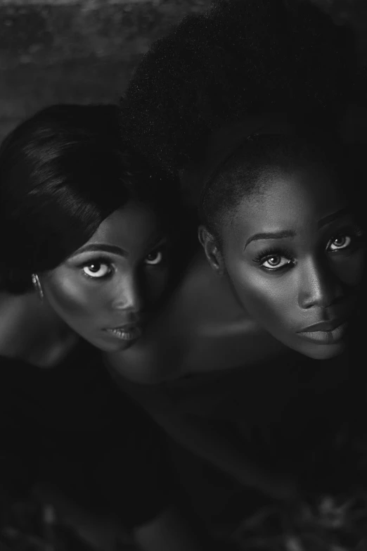 a black and white photo of two women, by Chinwe Chukwuogo-Roy, afrofuturism, beautiful gemini twins portrait, 5 0 0 px models, dark black porcelain skin, deviantart artstation cgscosiety