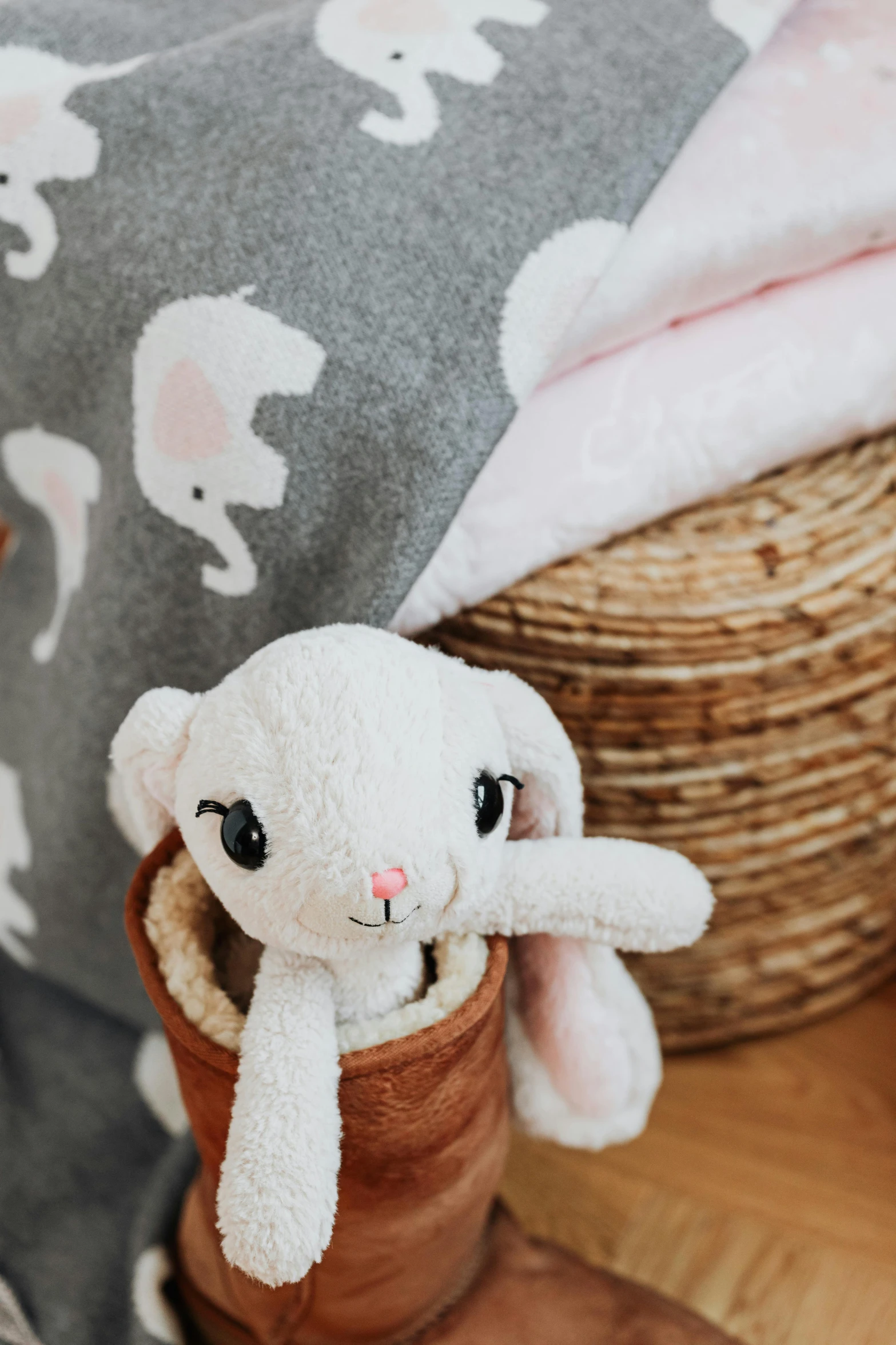 a close up of a stuffed animal in a pot, blush, multiple details, designed for cozy aesthetics!, covered with blanket