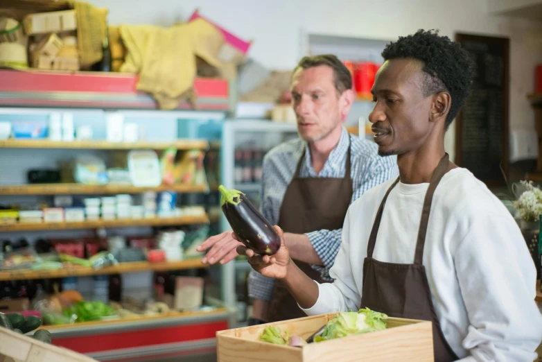 a couple of people that are standing in a store, pexels, renaissance, serving suggestion, fertile, baleful, brown