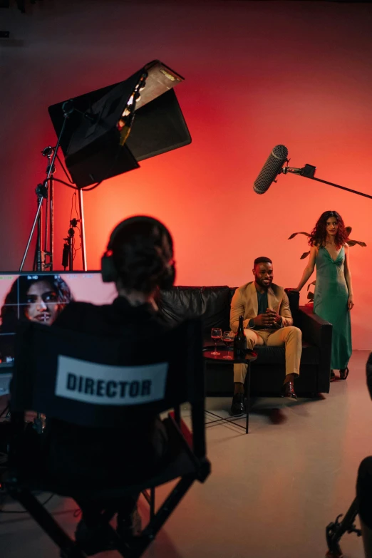 a woman in a green dress standing in front of a camera, meet the actor behind the scenes, “zendaya, lighting 8k, inside a grand studio