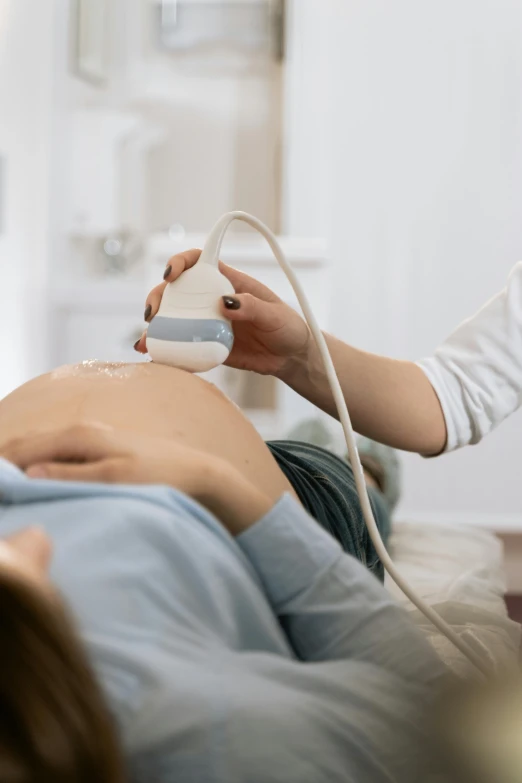 a close up of a person laying on a bed, membrane pregnancy sac, diagnostics, thumbnail, mummy