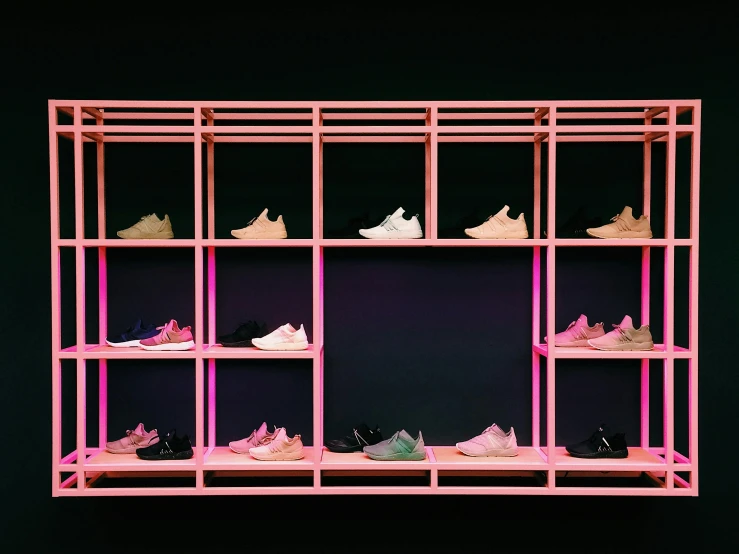 a pink shelf filled with lots of shoes, a digital rendering, unsplash, multiple lights, exhibition display, addidas, about to step on you