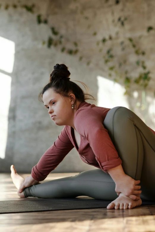 a woman is doing a yoga pose on the floor, pexels contest winner, renaissance, full figured, looking across the shoulder, brown, fleshy person with extra limbs