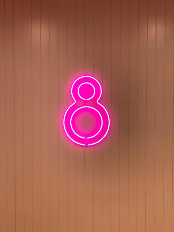a close up of a neon sign on a wall, 8l, pink, eight eight eight, in a mall
