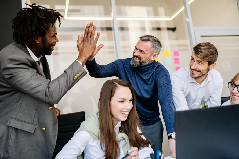 a group of people standing around a computer, greeting hand on head, post appocalyptic, professional modeling, multicoloured