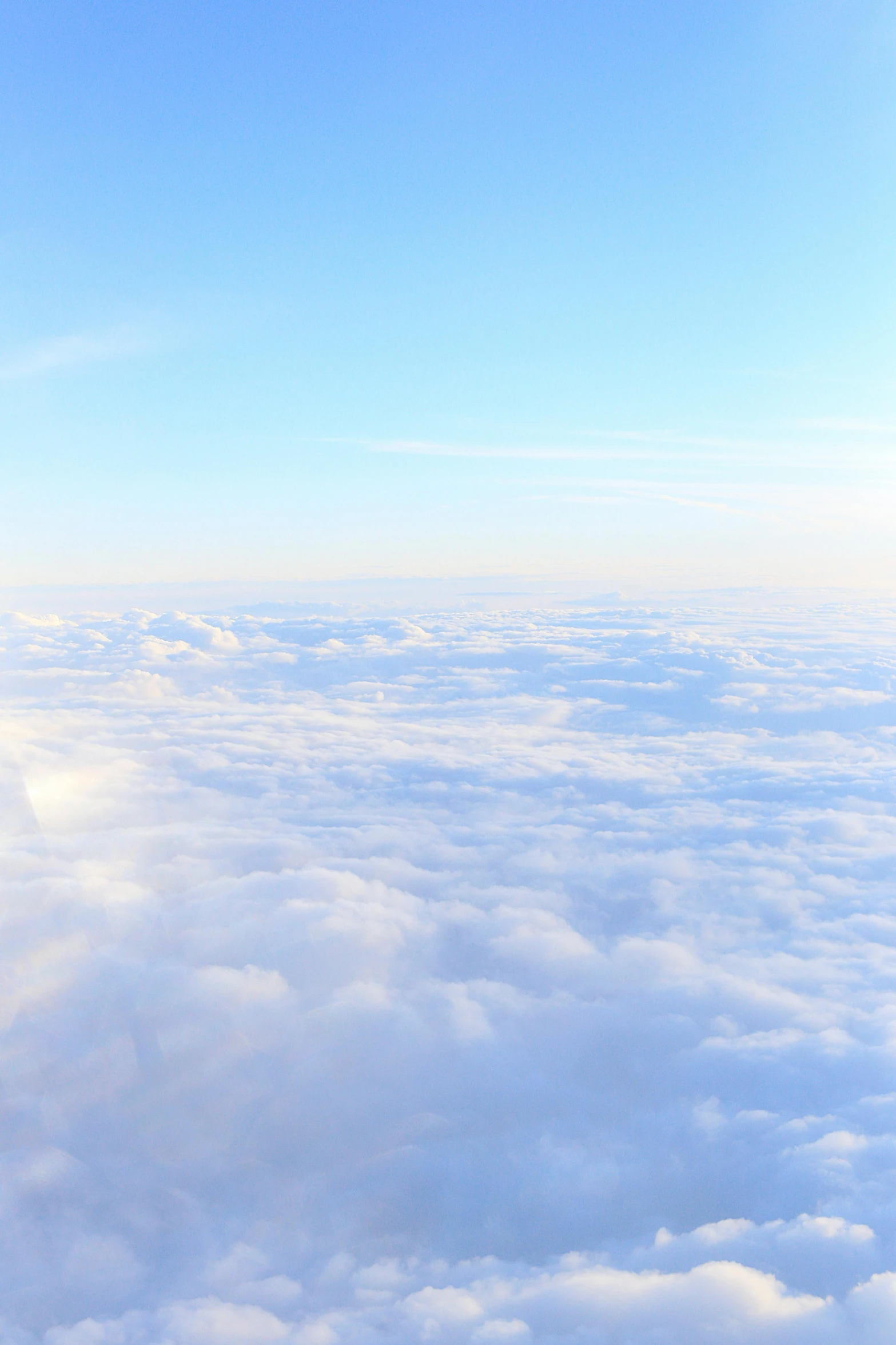 an airplane is flying high above the clouds, by Niko Henrichon, trending on unsplash, fluffy pastel clouds, major arcana sky, helicopter view, angels in the sky