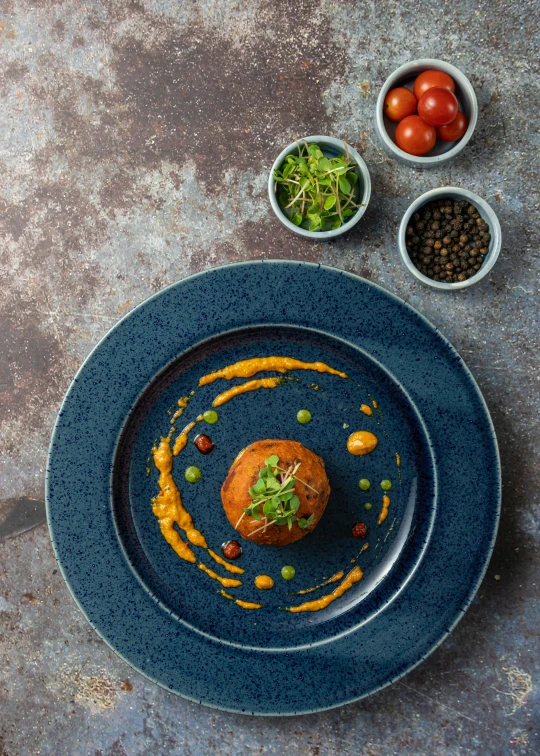 a close up of a plate of food on a table, by Andries Stock, dark blue + dark orange, thumbnail, plated, detailed product image