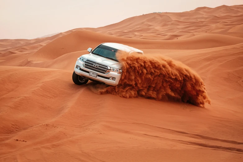 a white truck is driving through the desert, pexels contest winner, hurufiyya, falling sand inside, thumbnail, gta : dubai, red sand