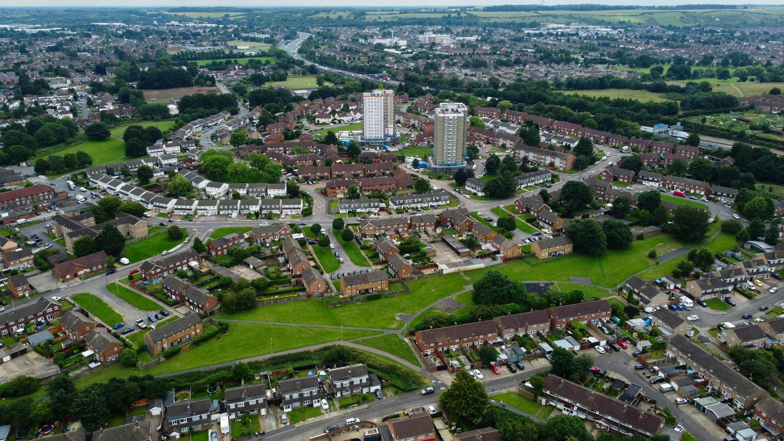 a bird's eye view of a residential area, by Julian Hatton, unsplash, photorealism, chesterfield, spacehip lands, teaser, drone photograpghy