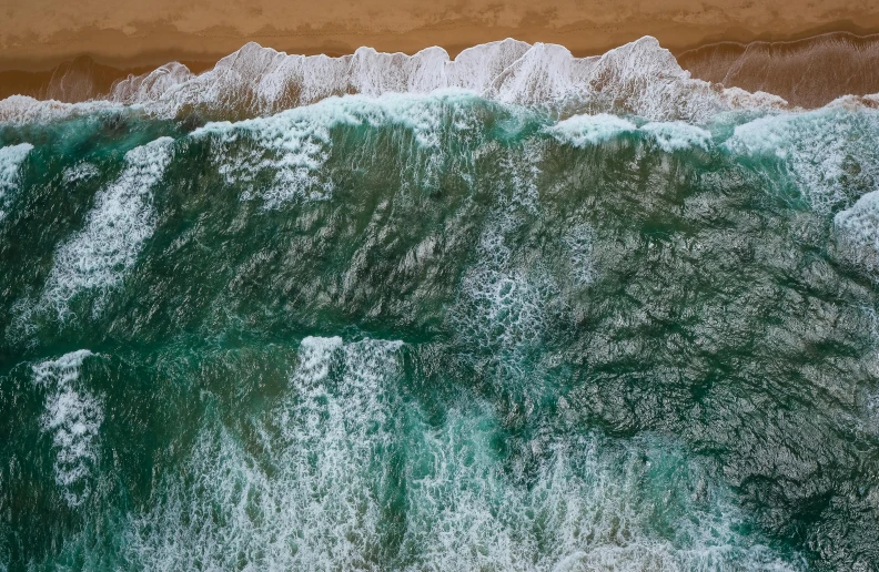 a person riding a surfboard on top of a wave, pexels contest winner, renaissance, drone view, intimidating floating sand, ocean pattern, a green