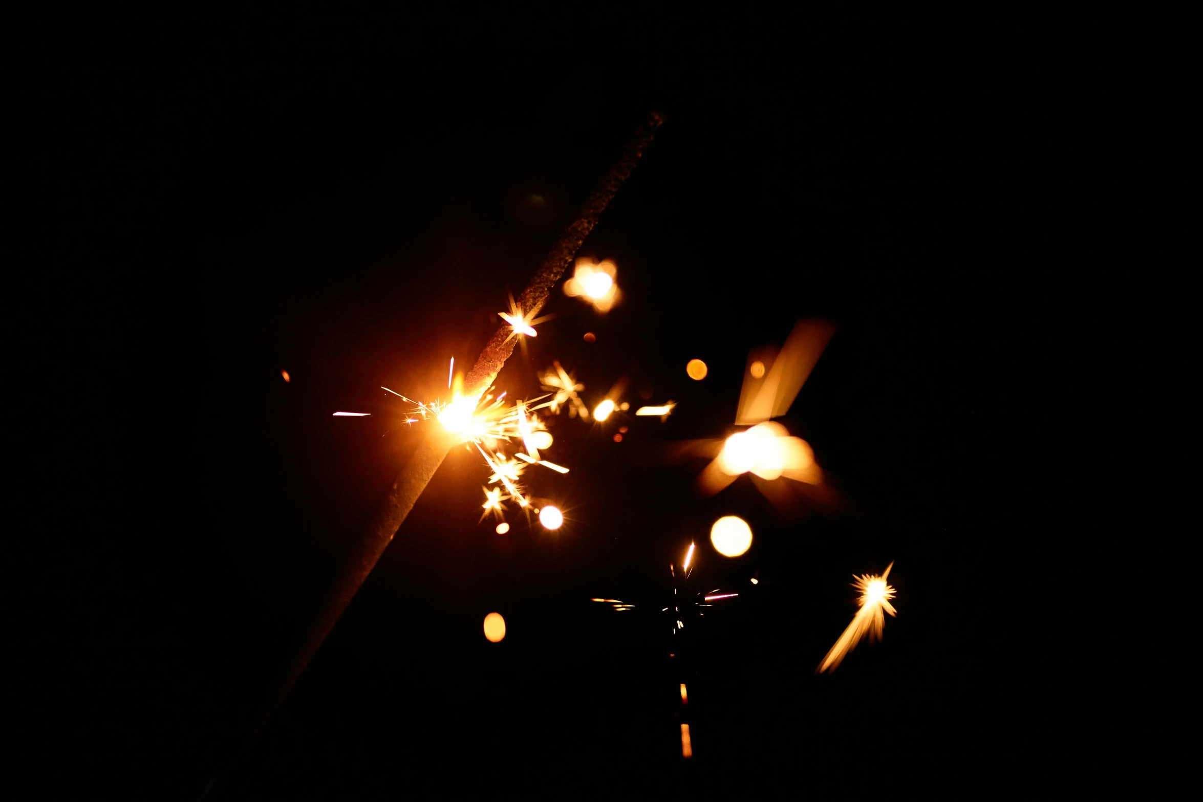 a close up of a sparkler in the dark, a picture, by Thomas Häfner, trent parke, metalwork, 1999 photograph, bright stars