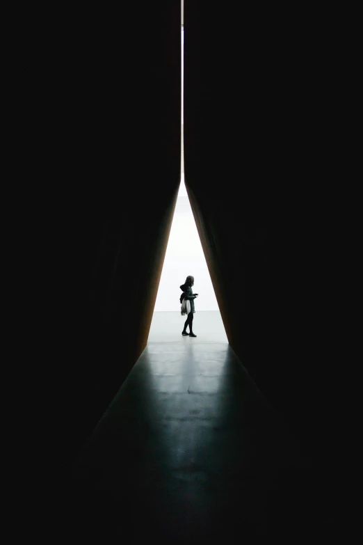 a person standing in a light at the end of a tunnel, by Matthias Weischer, pyramid portal, vsco film grain, anish kapoor black, single figure composition