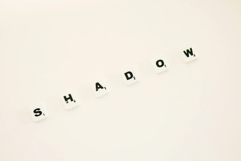 the word shadow spelled in black letters on a white background, by Emma Andijewska, trending on unsplash, dada, made of glowing wax and ceramic, shadowverse, showdown, shadow the hedgehog