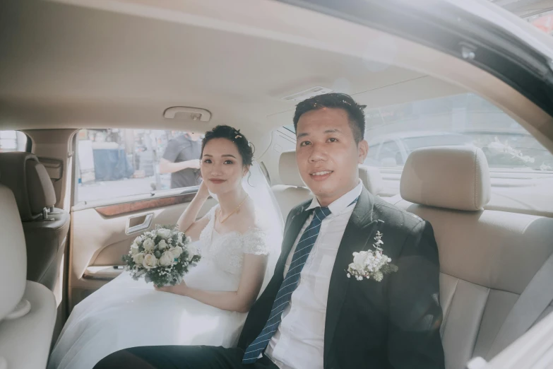 a bride and groom sitting in the back seat of a car, a picture, hoang long ly, avatar image, looking towards camera, profile image