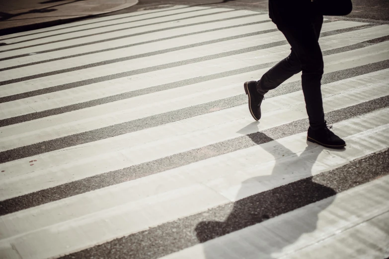 a person walking across a crosswalk holding an umbrella, pexels contest winner, square lines, running shoes, 15081959 21121991 01012000 4k, striped