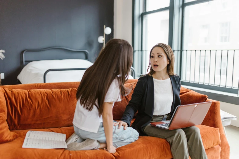 a woman sitting on a couch talking to another woman, trending on pexels, renaissance, office clothes, avatar image, sydney hanson, two girls