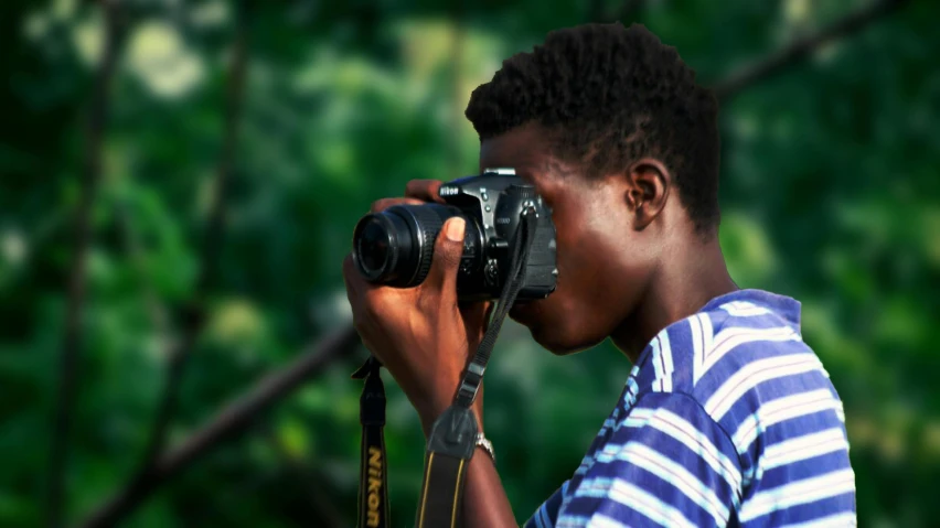 a person taking a picture with a camera, man is with black skin, colour photograph, illustration »