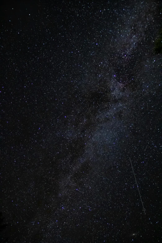 the milky shines brightly in the night sky, by Niko Henrichon, trending on unsplash, full frame image, low quality photo