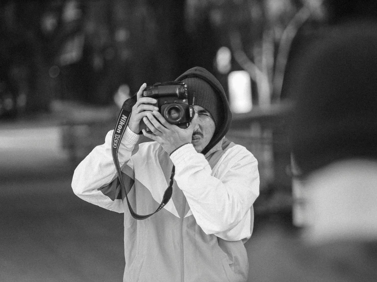 a person taking a picture with a camera, a black and white photo, mike stoklasa, street pic, 8k octan photo, portrait!!!