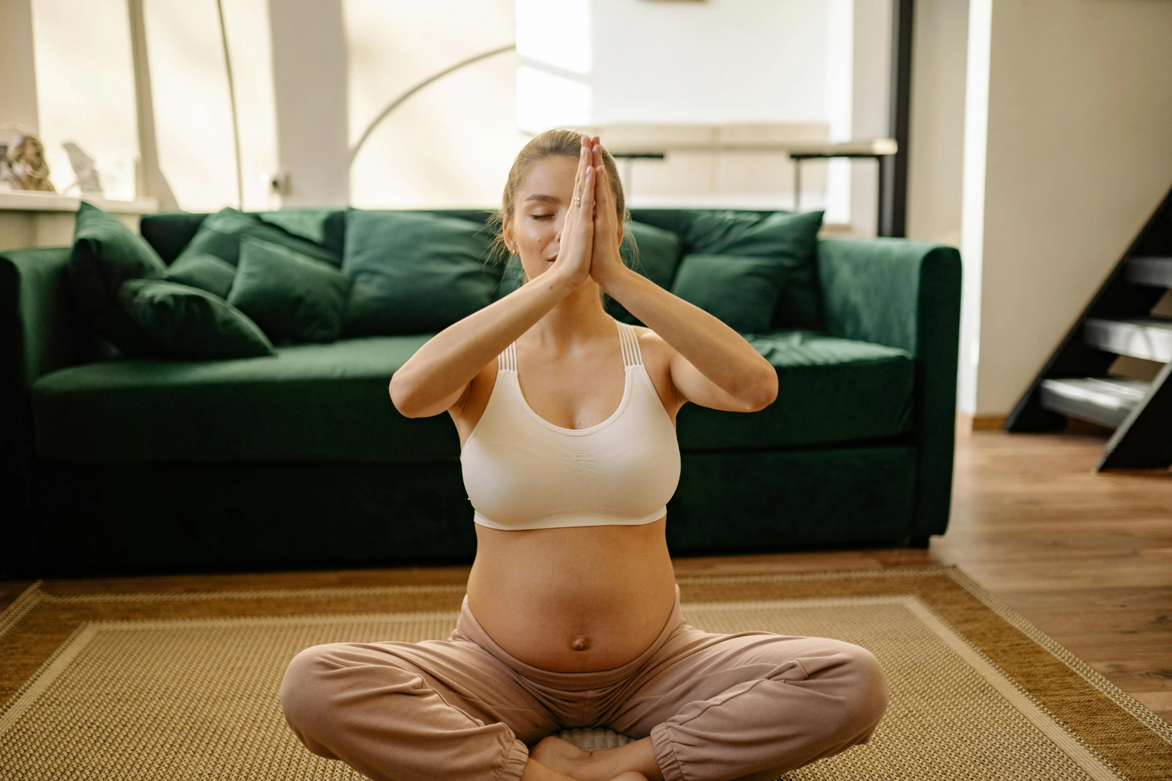 a pregnant woman doing yoga in a living room, trending on pexels, hurufiyya, natural realistic render, straya, hear no evil, physical : tinyest midriff ever