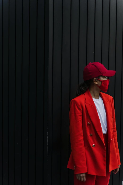 a woman in a red suit and a red hat, pexels contest winner, minimalism, wearing mask, trending on r/streetwear, gemma chen, androgyny