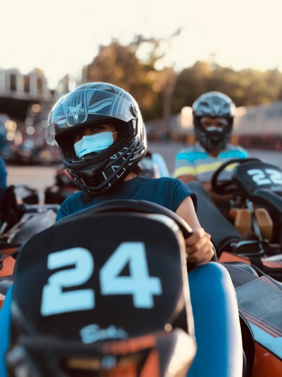 a group of go karting go karting go karting go karting go karting go karting go karting go karting go, by Kristian Zahrtmann, trending on unsplash, incoherents, face covers half of the frame, taken on iphone 14 pro, thumbnail, profile image