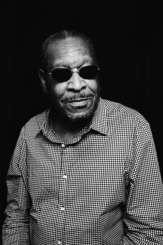 a black and white photo of a man wearing sunglasses, by Charles Ellison, morgan freeman, medium format. soft light, various posed, portrait of rung