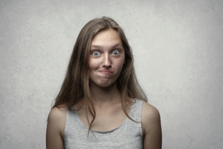 a woman with a surprised look on her face, a picture, pexels contest winner, antipodeans, sarcastic pose, teenager, square face, sarcastic and friendly