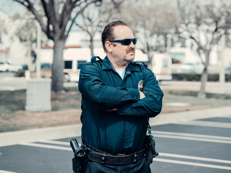 a man in a police uniform standing in a parking lot, unsplash, happening, avatar image, sam hyde, corinne day, thicc