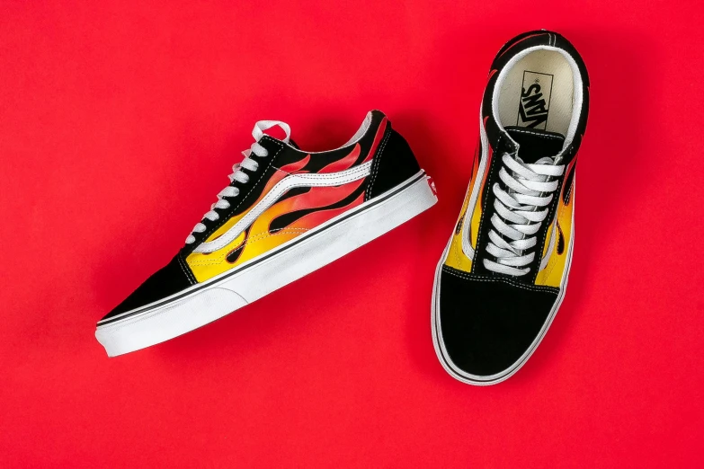 a pair of vans old skool vans old skool vans old skool vans old skool vans old skool vans old skool vans, by Julia Pishtar, sots art, on background red lake on fire, gradient yellow, front profile shot, pete davidson