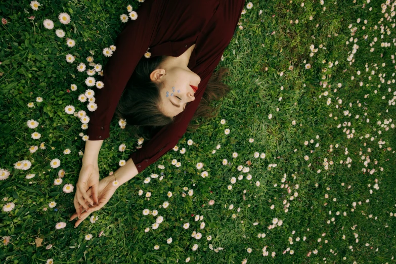 a woman laying in a field of daisies, inspired by Elsa Bleda, pexels contest winner, high angle shot, 15081959 21121991 01012000 4k, clemens ascher, on a green lawn