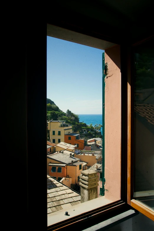 a bath tub sitting in a bathroom next to a window, inspired by Thomas Struth, unsplash contest winner, cinq terre, view from window, square, shot on webcam