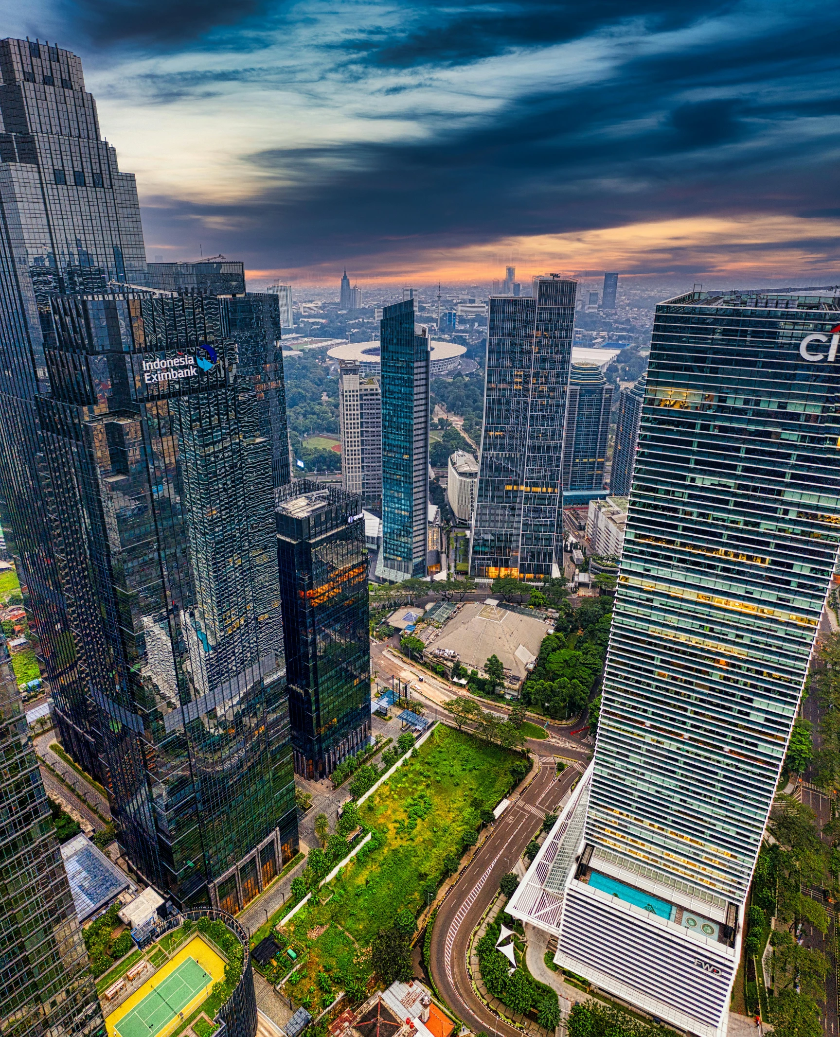 an aerial view of a city with lots of tall buildings, inspired by Paul Gustav Fischer, pexels contest winner, indonesia national geographic, square, corporate photo, hdr photo