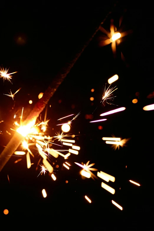 a close up of a sparkler in the dark, light and space, with sparking circuits, welding torches for arms, 1999 photograph, illustration »