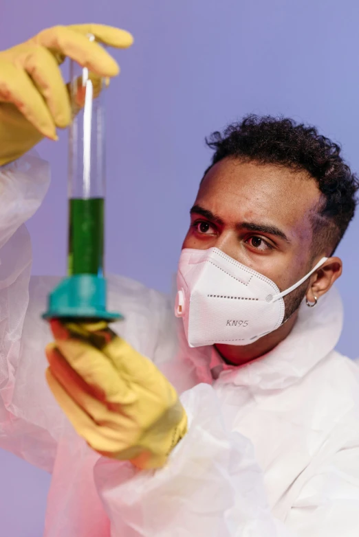 a man in a lab coat holding a test tube, rainbow colored dust mask, riyahd cassiem, dr zeus, synthetic bio skin