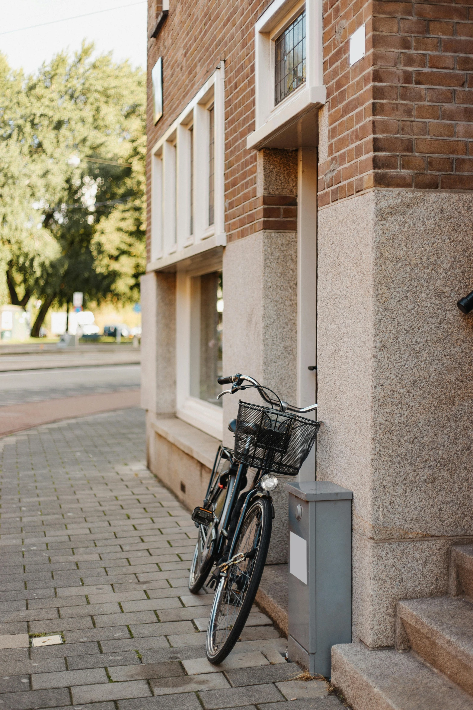 a bicycle leaning against the side of a building, by Jan Tengnagel, unsplash, realism, low quality photo, letterbox, espoo, snacks