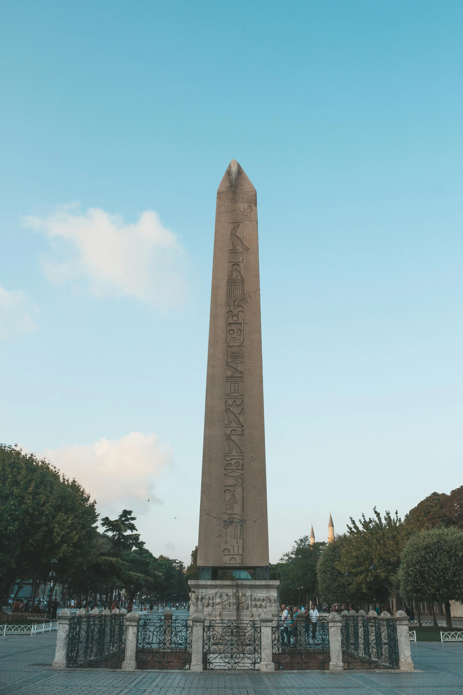 a tall obel sitting in the middle of a park, a statue, unsplash, les nabis, obelisk, etched inscriptions, byzantine, 🚿🗝📝