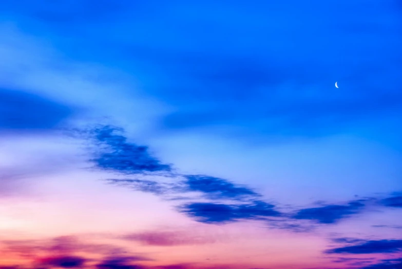 a plane that is flying in the sky, by Niko Henrichon, unsplash, minimalism, moon rising, blue and pink, multicolored, panorama view of the sky