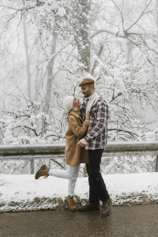 a man and woman standing next to each other in the snow, pexels contest winner, standing on a bridge, white, flirting, full body:: snow outside::