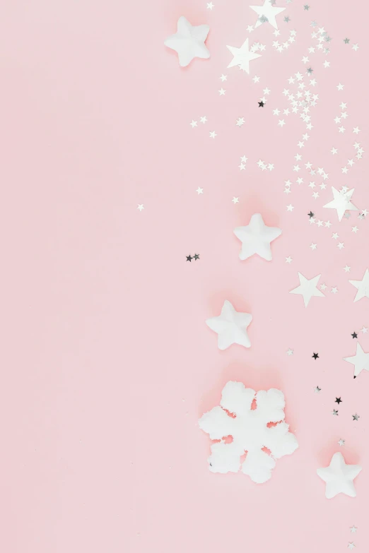 a pink background with stars and confetti, trending on unsplash, 9 9 designs, snowflakes, blank background, multiple stories