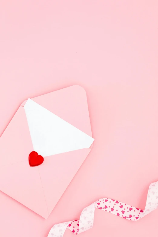 a white envelope with a red heart on a pink background, by Elaine Hamilton, pexels contest winner, society 6, made of cotton candy, toys, instagram photo