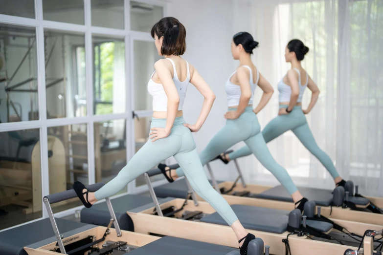 a group of women doing pilates exercises in a gym, trending on cg society, 奈良美智, hyperealistic photo, “ full body, very thin