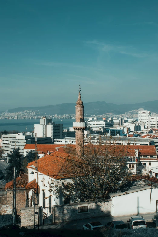 a view of a city from the top of a hill, inspired by Almada Negreiros, unsplash contest winner, renaissance, mosque, behance lemanoosh, bosnian, brown