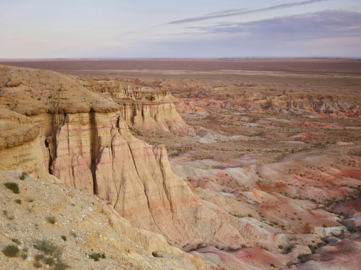 a view of the desert from the top of a hill, a detailed matte painting, by Pamela Ascherson, unsplash contest winner, photo of genghis khan, geological strata, pastel hues, 2000s photo