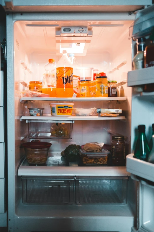 an open refrigerator filled with lots of food, pexels, orange light, drip, in house, unedited