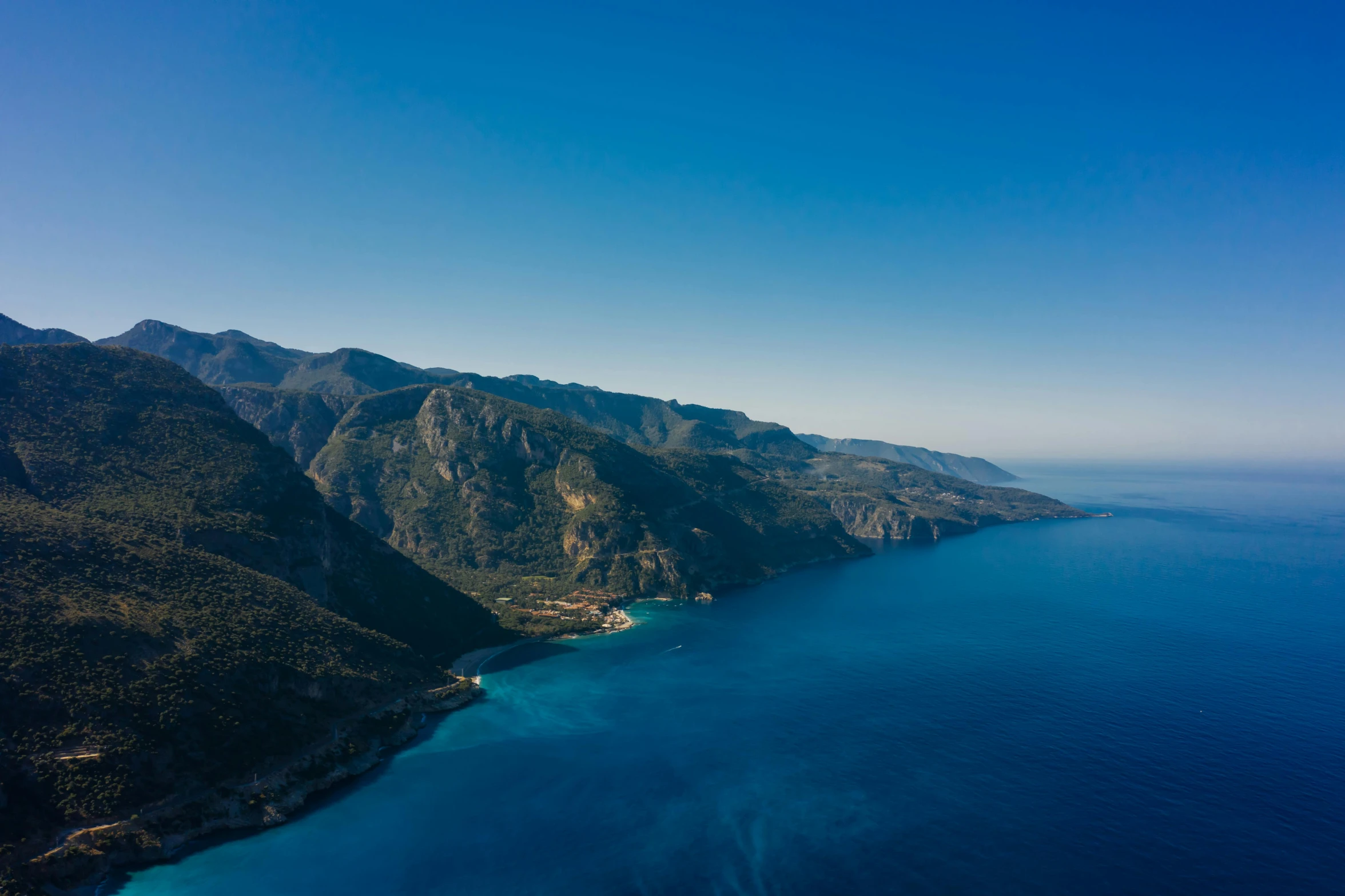 a large body of water surrounded by mountains, pexels contest winner, les nabis, blue sea, marbella landscape, flight, thumbnail