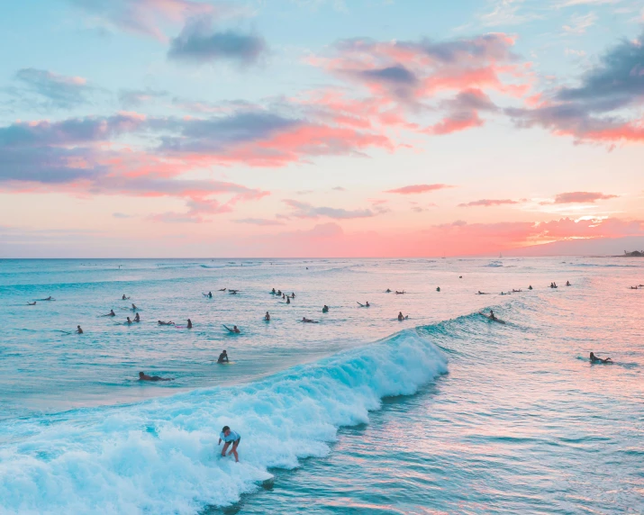 a group of people riding surfboards on top of a wave, pexels contest winner, pink clouds, waikiki beach, shades of pink and blue, wall of water either side